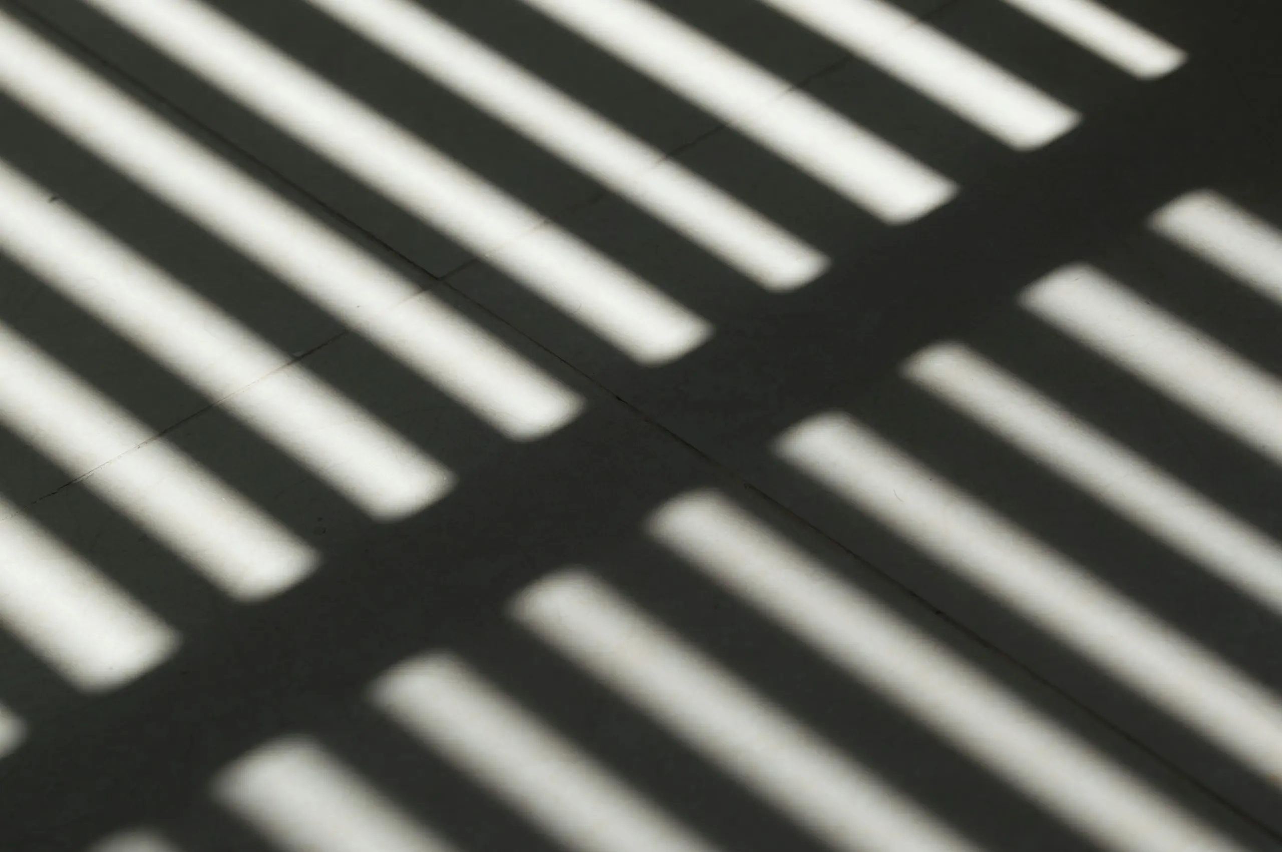 Soft bands of light and shadow across a surface